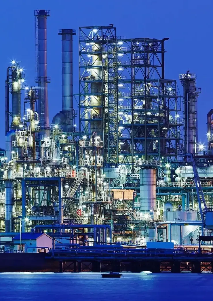 Petrochemical processing plant at night